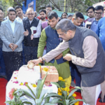 Union Education Minister Dharmendra Pradhan performing a traditional foundation-laying ceremony at IIT Delhi, breaking a coconut on a ceremonial brick for the new Academic Block and Girls' Hostel.