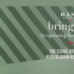 A bottle of Kama Ayurveda Bringaras Invigorating Scalp and Hair Oil showcased against a green striped background, highlighting the rebranding from the iconic Bringadi Oil.