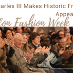 King Charles III sitting in the front row at London Fashion Week 2026, smiling and applauding alongside Stella McCartney and other fashion industry leaders during the Tolu Coker show.