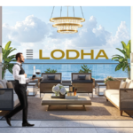 A luxurious open-air balcony lounge overlooking the ocean, featuring a professional butler serving drinks, high-end contemporary furniture, a gold chandelier, and the Lodha brand logo.