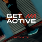A motion-blurred action shot of a runner in teal METROACTIV athletic shoes and black performance gear, featuring the "GET ACTIVE" slogan and METROACTIV logo against an urban industrial background.