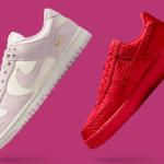 A high-contrast studio shot of two Nike sneakers from the 2026 Valentine's collection; one is a soft pink suede Dunk Low with a gold Swoosh, and the other is an all-over heart-embroidered Air Force 1 in vibrant University Red, set against a deep magenta background.