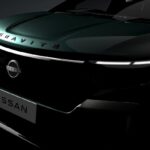 A close-up teaser of the Nissan Gravite's front end showing the illuminated V-Motion grille and "GRAVITE" hood branding.