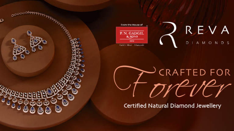 A high-end Reva Diamonds jewellery set featuring an intricate natural diamond and blue sapphire necklace with matching earrings, displayed on an earthy brown tiered pedestal against a dark background with "Crafted for Forever" branding.