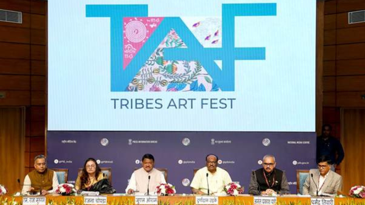 Tribes Art Fest 2026: India’s Indigenous Masterpieces Now Open for Public at Travancore Palace 1 A panel of six officials seated at a press conference table under a large screen displaying the "TAF TRIBES ART FEST" logo featuring colorful tribal motifs.