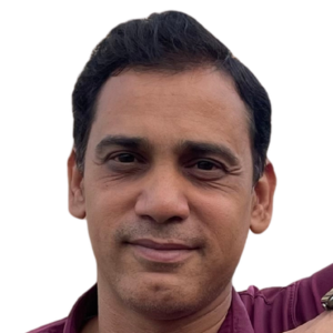 About Us 3 Headshot of Ashfaque, an udhq social strategist with dark hair and a maroon shirt, smiling against a plain white background.