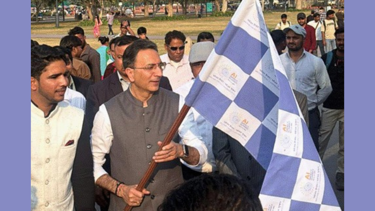 An official flagging off the Kaushal Rath mobile AI bus in Delhi to launch the Yuva AI for All literacy program.