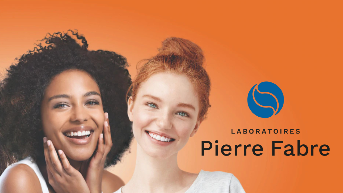 How AI and Synthetic Patient Data are Revolutionizing Avène’s New Skincare Trials 1 Two smiling women of diverse ethnicities posing against an orange background next to the Laboratoires Pierre Fabre logo.