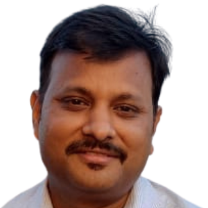 About Us 4 Headshot of Rajesh, a technical web lead with dark hair and a mustache, wearing a light-colored collared shirt against a plain background.