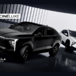 A high-contrast studio shot of the new Mahindra XEV 9e Cineluxe Edition in its exclusive Satin Black and Satin White matte finishes, highlighting its signature LED DRLs and ₹29.35 Lakh introductory price.