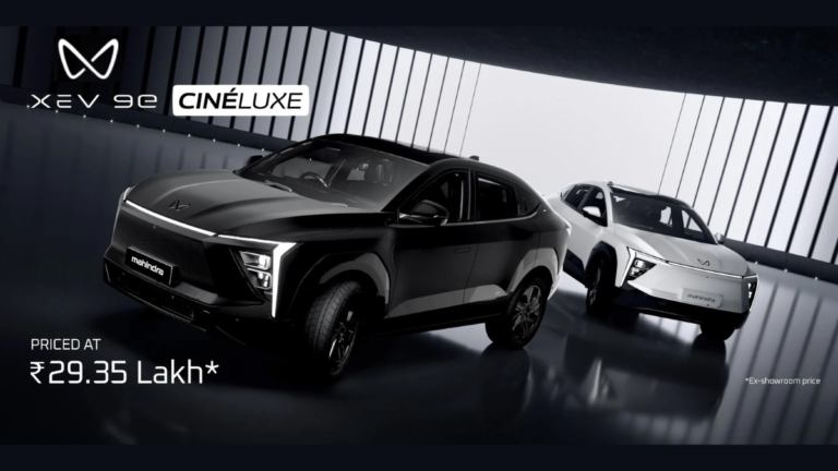 A high-contrast studio shot of the new Mahindra XEV 9e Cineluxe Edition in its exclusive Satin Black and Satin White matte finishes, highlighting its signature LED DRLs and ₹29.35 Lakh introductory price.