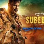 Official movie poster for the Prime Original film Subedaar, featuring Anil Kapoor at the top, Radhikka Madan on the left, and supporting cast members below against a gritty, sunset-toned action backdrop.