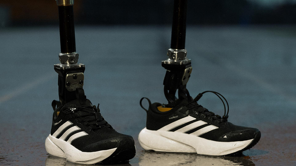 adidas Supernova Rise 3 Adaptive: A New Era of Inclusive Performance Running 3 A pair of black adidas Supernova Rise 3 Adaptive running shoes fitted onto an athlete’s running blade prosthetics.