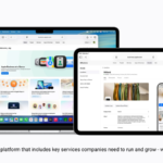 A MacBook, iPad, and iPhone displaying the new Apple Business unified platform interface, scheduled for an April 14 launch.