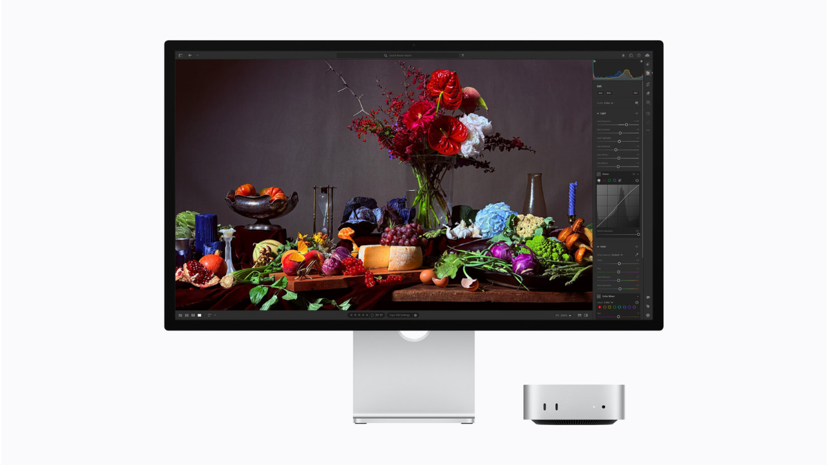 New Apple Studio Display XDR paired with a Mac mini, showing a professional photo editing interface in a clean workspace.
