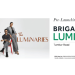 Marketing banner for Brigade Lumina on Tumkur Road, Bengaluru, featuring two models under the campaign "The Luminaries" and the slogan "Welcome to a lifestyle defined by its residents".