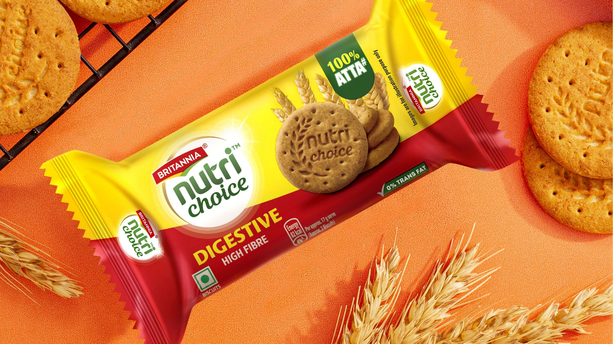 Britannia’s 2026 Launch Blitz: From Aamir Khan’s NutriChoice to the Viral 50-50 Cheeze Dipped 2 Britannia NutriChoice Digestive 100% Atta High Fibre biscuit pack on an orange background with wheat stalks.