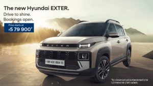 Front three-quarter view of the new 2026 Hyundai Exter facelift in a Khaki-sand finish showing the starting price of ₹5,79...