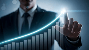 A businessman in a suit pointing to a glowing, upward-trending bar graph representing financial growth and successful IPO ...