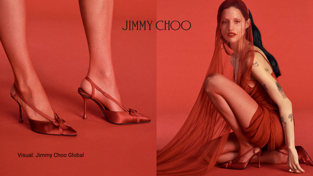 Close up of red satin Jimmy Choo FAYA pumps with JC monogram wax seal detail from the Rules of Engagement campaign.