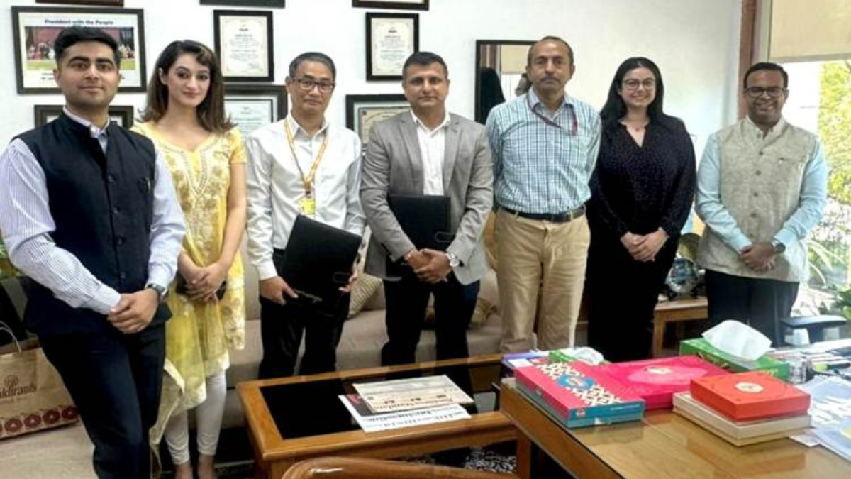 Officials from KRAFTON India and DPIIT posing together with signed Memorandum of Understanding documents at a formal ceremony.