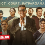Cast of Netflix series Maamla Legal Hai featuring Ravi Kishan as a lawyer standing in front of the Patparganj District Court sign in Delhi.