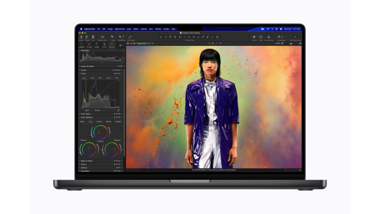 Front-facing view of the new MacBook Pro in Space Black running professional photo editing software Capture One on a Liquid Retina XDR display.
