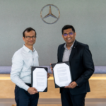 Prof. Preeti Ranjan Panda of IIT Delhi and Manu Saale of Mercedes-Benz Research and Development India holding the formal 5-year Master Research Agreement for joint innovation in future mobility.