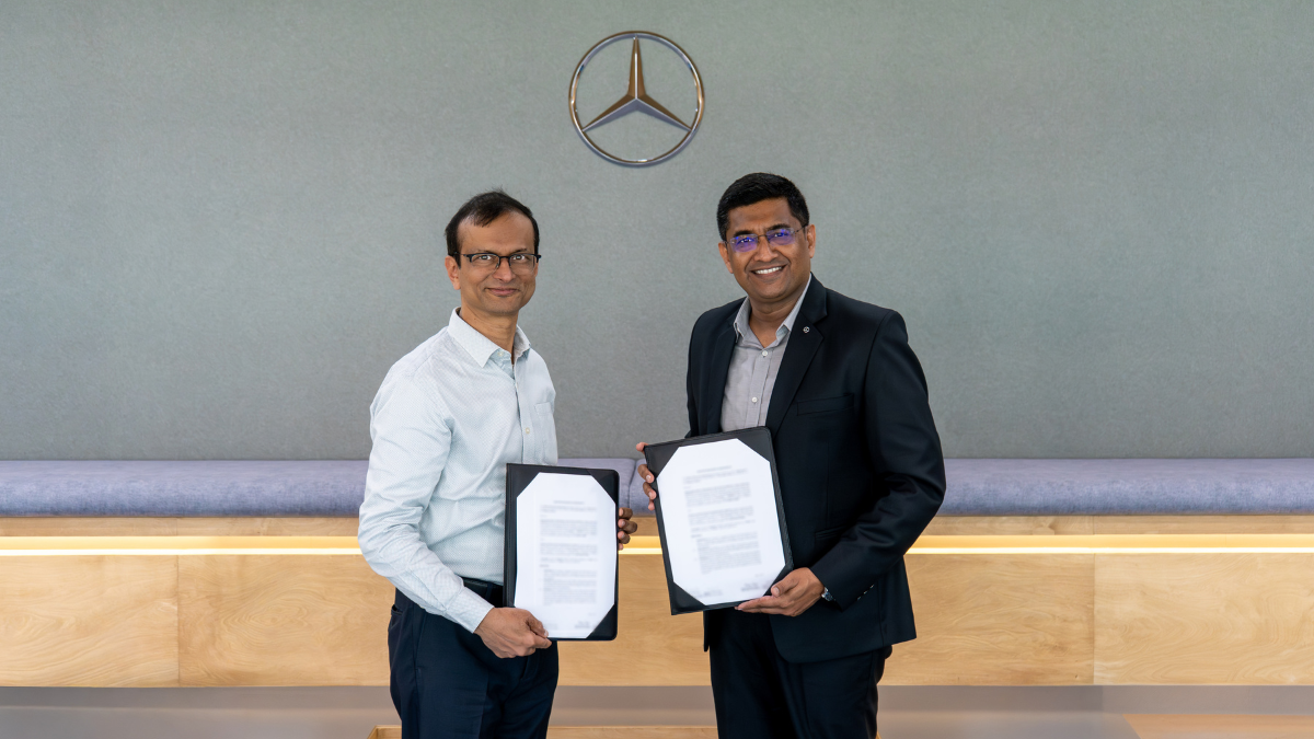 Mercedes-Benz & IIT Delhi Partner to Pioneer Quantum Tech and Next-Gen EV Batteries 1 Prof. Preeti Ranjan Panda of IIT Delhi and Manu Saale of Mercedes-Benz Research and Development India holding the formal 5-year Master Research Agreement for joint innovation in future mobility.