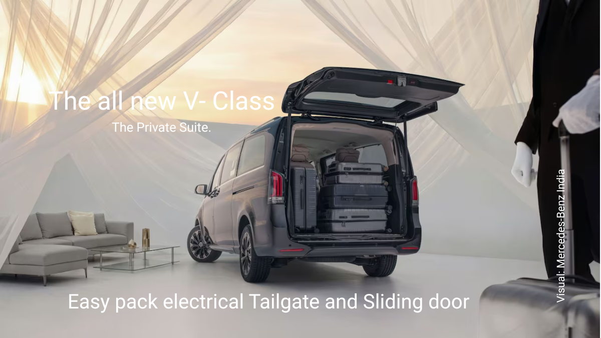 Rear view of black Mercedes-Benz V-Class with electric tailgate open showing large luggage capacity.