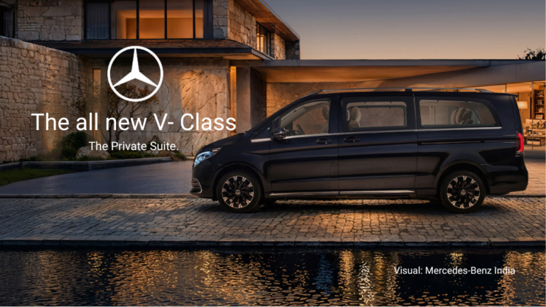 Exterior shot of the Mercedes-Benz V-Class parked in front of a luxury villa at sunset.