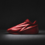 A side-profile studio shot of the all-red Nike KD19 basketball shoe highlighting the prominent TPU dagger lockdown system on the midfoot.