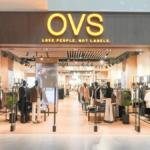 Exterior view of the OVS flagship store at Sky City Mall Borivali Mumbai, featuring a modern wood-paneled storefront with the slogan 'Love People Not Labels'.