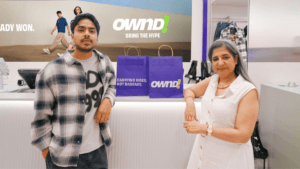 Actor Adarsh Gourav and Sangeeta Tanwani, CEO of Pantaloons and OWND!, posing at the billing counter of the new OWND! stor...