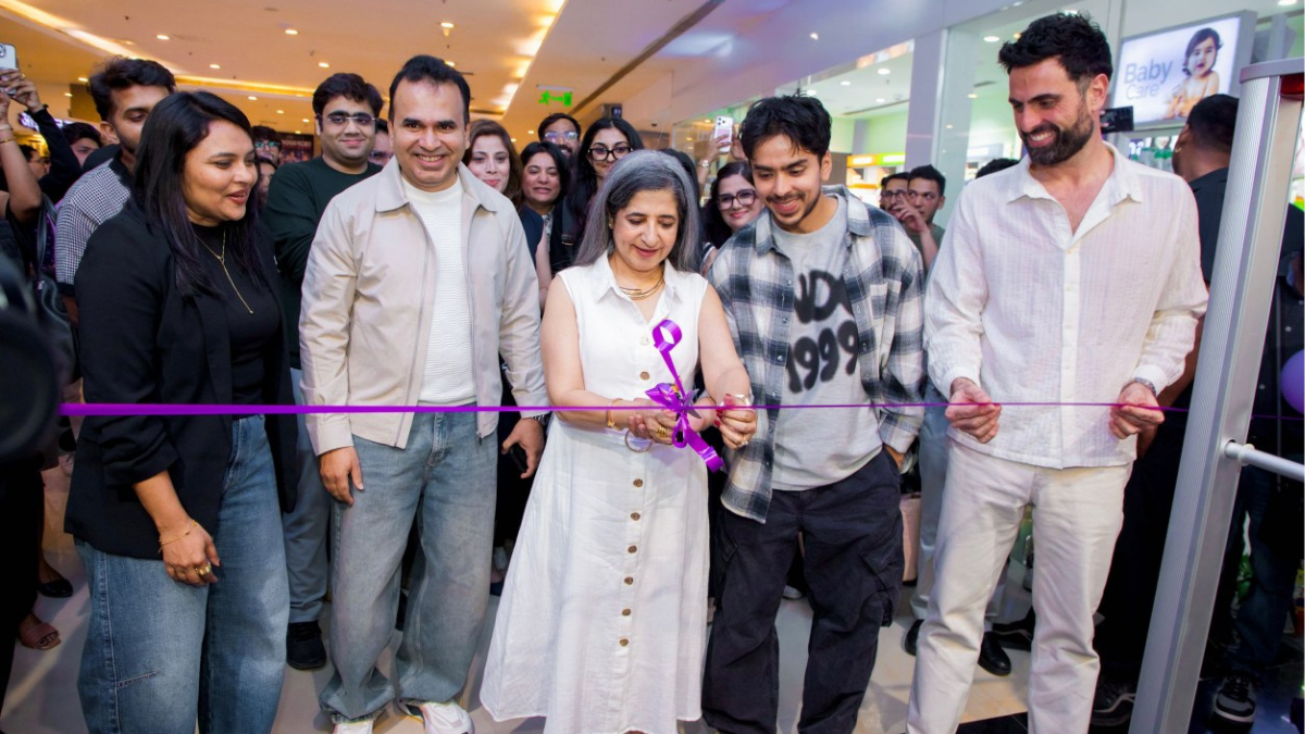 Sangeeta Tanwani and Adarsh Gourav cutting the purple ribbon to officially open the new OWND! store in Mumbai.