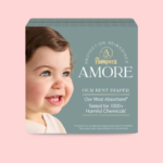 Pampers AMORE product packaging box featuring a smiling baby and text highlighting it as the most absorbent diaper tested for 1000+ harmful chemicals.