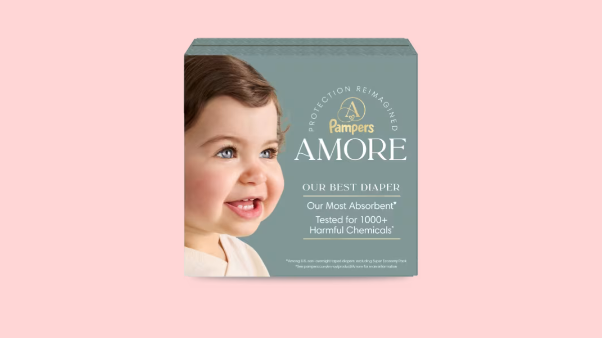 Pampers AMORE product packaging box featuring a smiling baby and text highlighting it as the most absorbent diaper tested for 1000+ harmful chemicals.