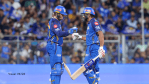 Mumbai Indians openers Rohit Sharma and Ryan Rickelton fist-bumping on the pitch after a record-breaking 148-run opening p...