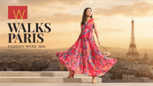 Official campaign graphic for W Walks Paris Fashion Week 2026 featuring a model in a vibrant floral pleated maxi dress wit...