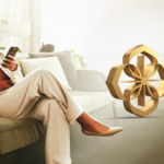 A woman smiling while checking her Maharaja Club points on a smartphone and holding a gold tier membership card next to a golden 3D logo.