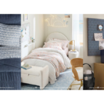 Floral and wave pattern bedding with a palm tree neon light in a coastal dorm setup for the India launch