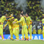 Chennai Super Kings players Jamie Overton, Gurjapneet Singh, and teammates celebrate a wicket against Delhi Capitals durin...