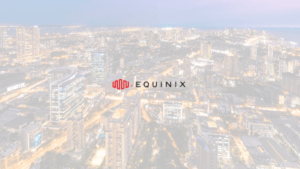 Aerial skyline view of Mumbai city at dusk with the red and black Equinix company logo centered, representing the launch o...
