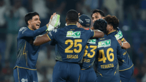 Gujarat Titans players including Shubman Gill, Kagiso Rabada, and Rahul Tewatia celebrate a dramatic 1-run victory over De...