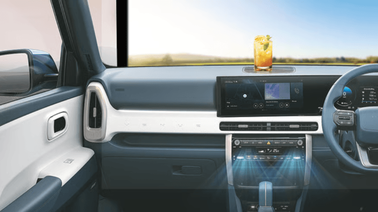 : Interior dashboard of a Hyundai car showing blue airflow graphics from AC vents with a refreshing summer drink on the da...