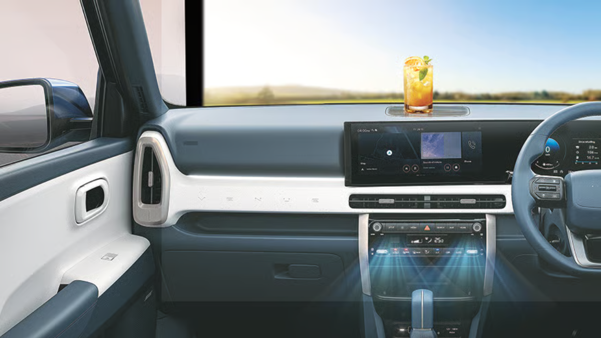 : Interior dashboard of a Hyundai car showing blue airflow graphics from AC vents with a refreshing summer drink on the dash to represent cooling comfort.