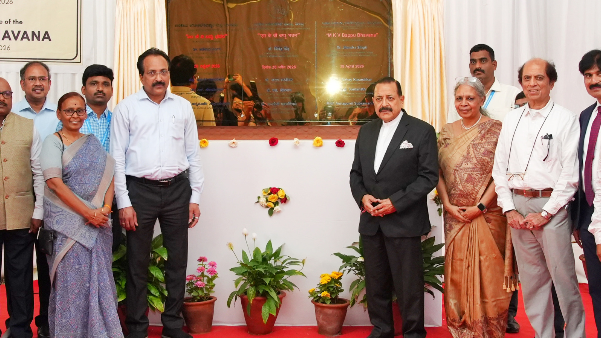 Dr. Jitendra Singh and S. Somanath standing with scientists in front of a golden foundation stone plaque in Bengaluru.