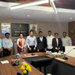Officials standing in a Ministry of Coal office during the signing of the India coal gasification agreement.