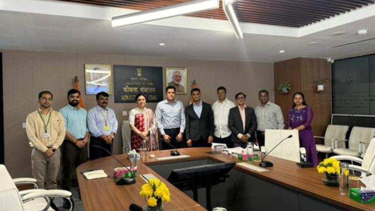 Officials standing in a Ministry of Coal office during the signing of the India coal gasification agreement.