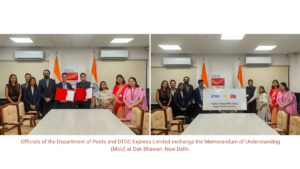 Officials exchange MoU folders (left) and pose with a PIN code reach sign (right) in an office with Indian flags.